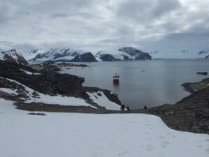 A majestic view of the RRS Ernest Shackleton in the bay by Signy Station, behind which is Coronation Island, a barrier between Signy and Drakes Passage.
