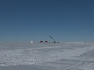 Preparations for the next winter season, the raising of the VSAT dome (communications), the IT caboose and the MET caboose. The Sennebogen crane sits near to the weather apparatus and the uprights for the HF antenna can also be seen.